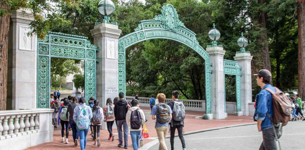 High school students walking through Sather Gate on the UC Berkeley campus
