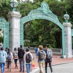High school students walking through Sather Gate on the UC Berkeley campus